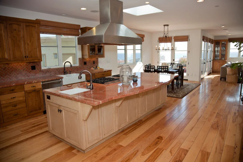 a kitchen sink with hardwood flooring